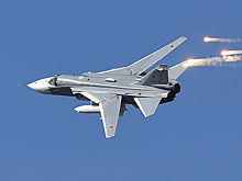 Российский Су-24 выпустил тепловые ловушки вблизи корабля США